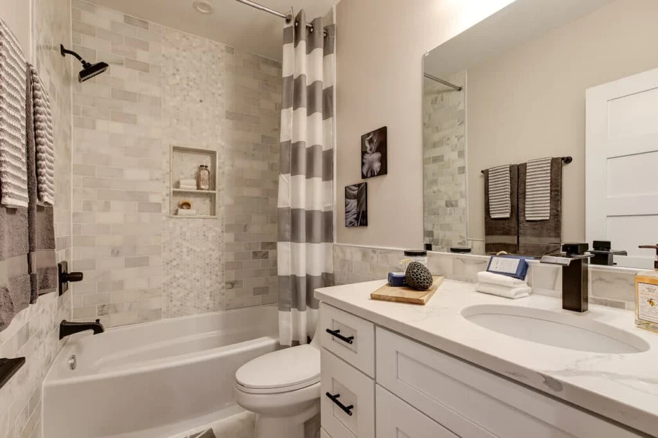old style bathtub with new walls and vanity