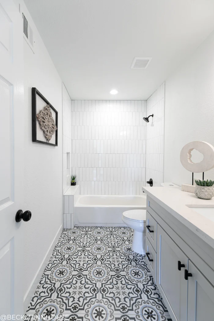 full white bathroom with design style floors