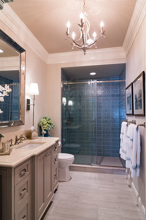 custom vanity in bathroom and hanging lighting fixture