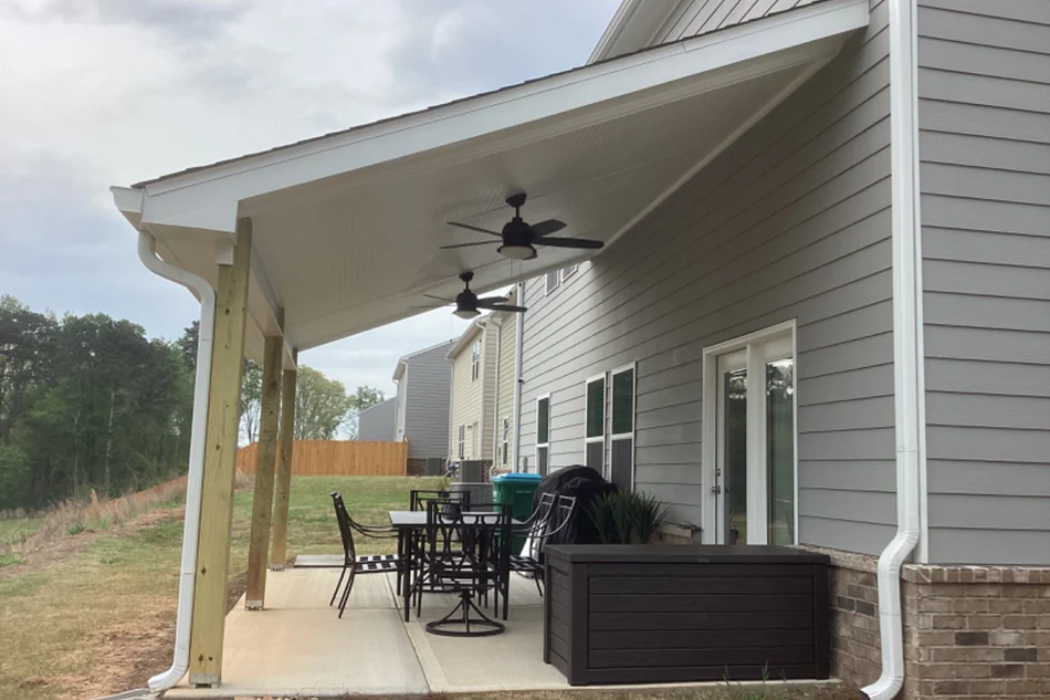 Deck and patio installation completed by A New Day Construction in Winder, GA, featuring a covered patio structure and expanded backyard living space.